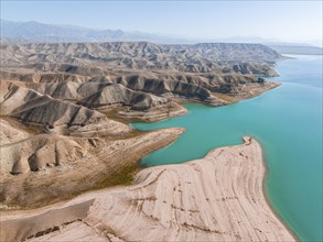 Barren landscape, aerial view, erosion landscape with canyons on the Naryn River, Toktogul