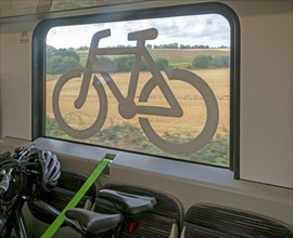 Bicycle storage area with window sign on Greater Anglia train, Suffolk, England, UK