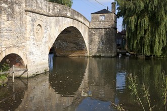 Historic stone bridge crossing River Thames at Lechlade on Thames, Gloucestershire, England, UK