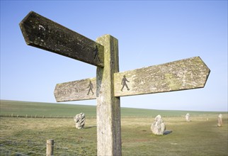 Wooden footpath signpost at the Avenue, Avebury World Heritage site, Wiltshire, England, UK