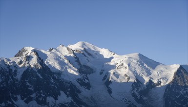 Morning atmosphere, mountain landscape at sunrise, glaciated mountain peak of Mont Blanc in the