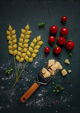 Food concept, pasta, with cherry and parmesan cheese, top view, no people, wheat, pasta spikelets