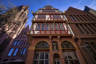 Goldene Waage coffee house, reconstructed Renaissance half-timbered house, next to St Bartholomew's