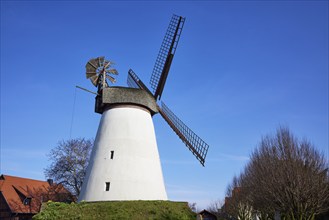 Windmill Hummelbecker Mühle against a cloudless blue sky, a Wall-Holländer, is part of the