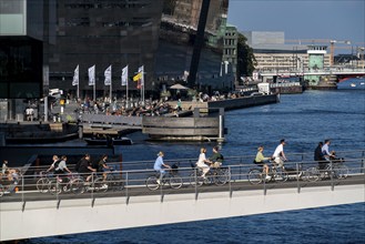 Cyclists on the Lille Langebro cycle and pedestrian bridge over the harbour, Copenhagen is