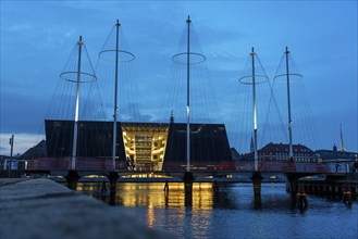 Cyclists on the Cirkelbroen cycle and pedestrian bridge, over the harbour, in the Christianshavens