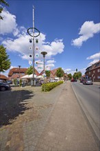 Maypole against blue sky with cumulus clouds at Haltener Strasse in Hausdülmen, Dülmen,