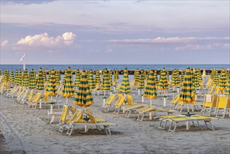 Bathing beach on the Adriatic in bad weather. All deckchairs are free. Bellaria-Igea Marina,