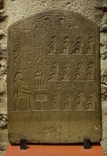 Funerary slab stele showing Egyptian offerings' scene and hieroglyphs dating to the late 12th