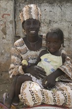 Mother with child posing on the roadside, Gambia, Africa, Africa