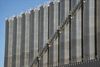 Stainless steel tanks of a large silo facility in Duisburg inland harbour, Duisburg-Neuenkamp, for