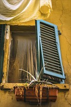 Dilapidated unkempt open window, dilapidated, building, property, crisis, facade, withered, Italy,