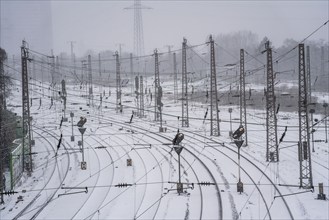 Onset of winter with lots of fresh snow and temperatures below -5 degrees during the day, railway