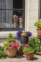 Decoration in and in front of a house in the historic centre of Amsterdam, Sint Antoniesluis,