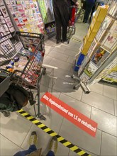 Effects of the corona crisis in Germany, sticker on the floor informs customers of a supermarket