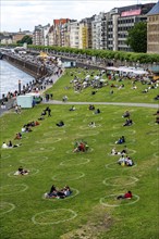 Düsseldorf on the Rhine during the corona crisis, corona circles, to comply with the distance