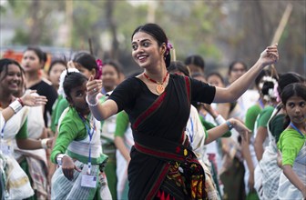 An instructor dance Bihu, as she teach participants during a Bihu dance workshop, ahead of Rongali