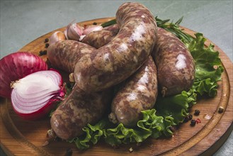 Raw kupaty, traditional Georgian sausages, raw sausages, with spices and herbs, Georgian cuisine