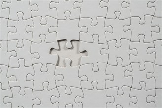 Puzzle game, blank, white, without motif, for printing, one piece missing