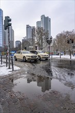 Puddle, winter in the city, Deutsche Bank building, Sparkasse, Trianon Frankfurt building,