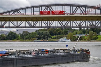 The Beeckerwerth Rhine bridge of the A42 motorway, truck traffic, behind it the Haus-Knipp railway