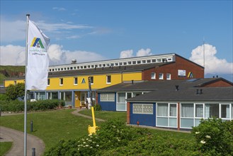 Youth hostel, Haus der Jugend im Unterland, flag with YH emblem, Helgoland Island, North Sea,