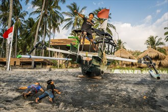 Jumping children in the evening sun at Mangsit beach in Sengiggi, travel, tourism, sea, beach,