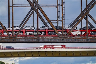 The Beeckerwerther Rhine bridge of the A42 motorway, truck traffic, in front of it the Haus-Knipp