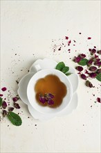 Cup of tea, damask rose, pink tea, close-up