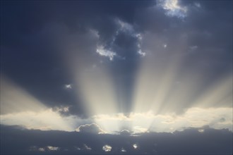 Dramatic sky with sunbeams breaking through, Spessart, Germany, Europe