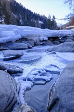 Inn or En near Scuol in winter, with ice floes, Engadin, Grisons, Switzerland, Europe