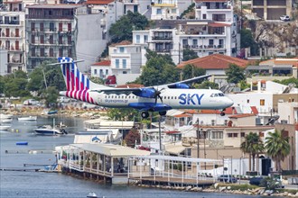 An ATR 72-600 Sky Express aircraft with the registration SX-FIT at Skiathos Airport, Greece, Europe