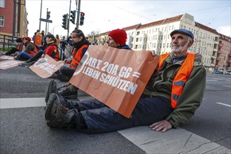 Activists of the Last Generation have taped their hands on a street, Berlin, 24 04 2023