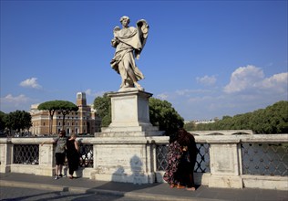 Statue of the angel with the sweat cloth on the Angels' Bridge over the Tiber, Rome, Italy, Europe