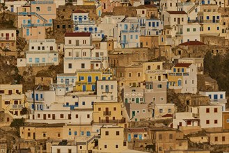 Colourful houses on a hillside in the warm sunlight, Colourful mountain village, Morning light,