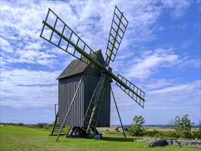 Three traditional historic windmills (Resmo väderkvarnar) in the village of Resmo on Öland, Kalmar