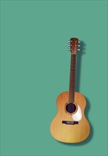 Classic guitar over green background, textured copy space effect