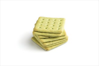 Green cracker pile isolated on white background. side view, close up