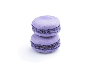 Purple macarons or macaroons cakes isolated on white background. Side view, close up