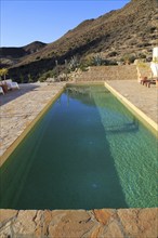 Swimming pool at tourist accommodation, Los Presillas Bajas, Cabo de Gata natural park, Almeria,