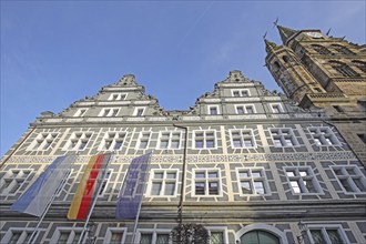 Renaissance building with sgraffiti and flags, EU flag, German state flag, Bavarian state flag and