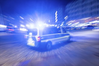 A police vehicle in action, with blue light switched on, Dresden, Saxony, Germany, Europe