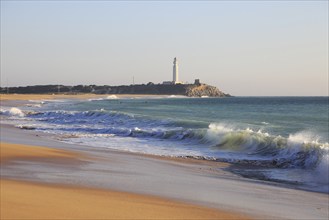 Sandy beach and lighthouse at Cabo de Trafalgar, Cadiz Province, Spain, Europe