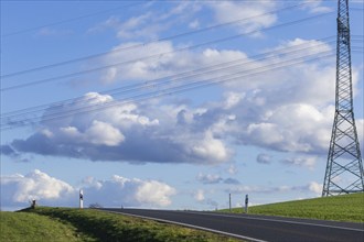 Cloudy sky over the B170 with overhead power line, Karsdorf, Saxony, Germany, Europe