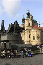 Jan Hus Monument on Old Town Square and the baroque St Nicholas Church, Prague, Czech Republic,