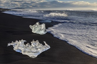 Ice floes on the beach, waves, sunny, morning mood, winter, Diamond Beach, Breidamerkursandur,