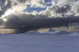 Cloudy mood and snowstorm over an old volcano, snow, winter, Neshraun, Snaefellsnes, Vesturland,