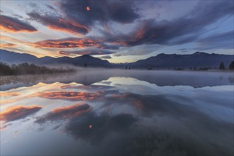 Mountains reflected in lake, footbridge, cloudy mood, morning light, silence, tranquillity,