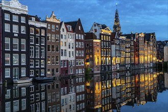 Canal houses on the Damrak, in the centre of the old town of Amsterdam, harbour, starting point of