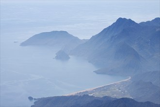 View of the Turkish Riviera from the snow-covered Tahtali Dagi, Turkey, Asia